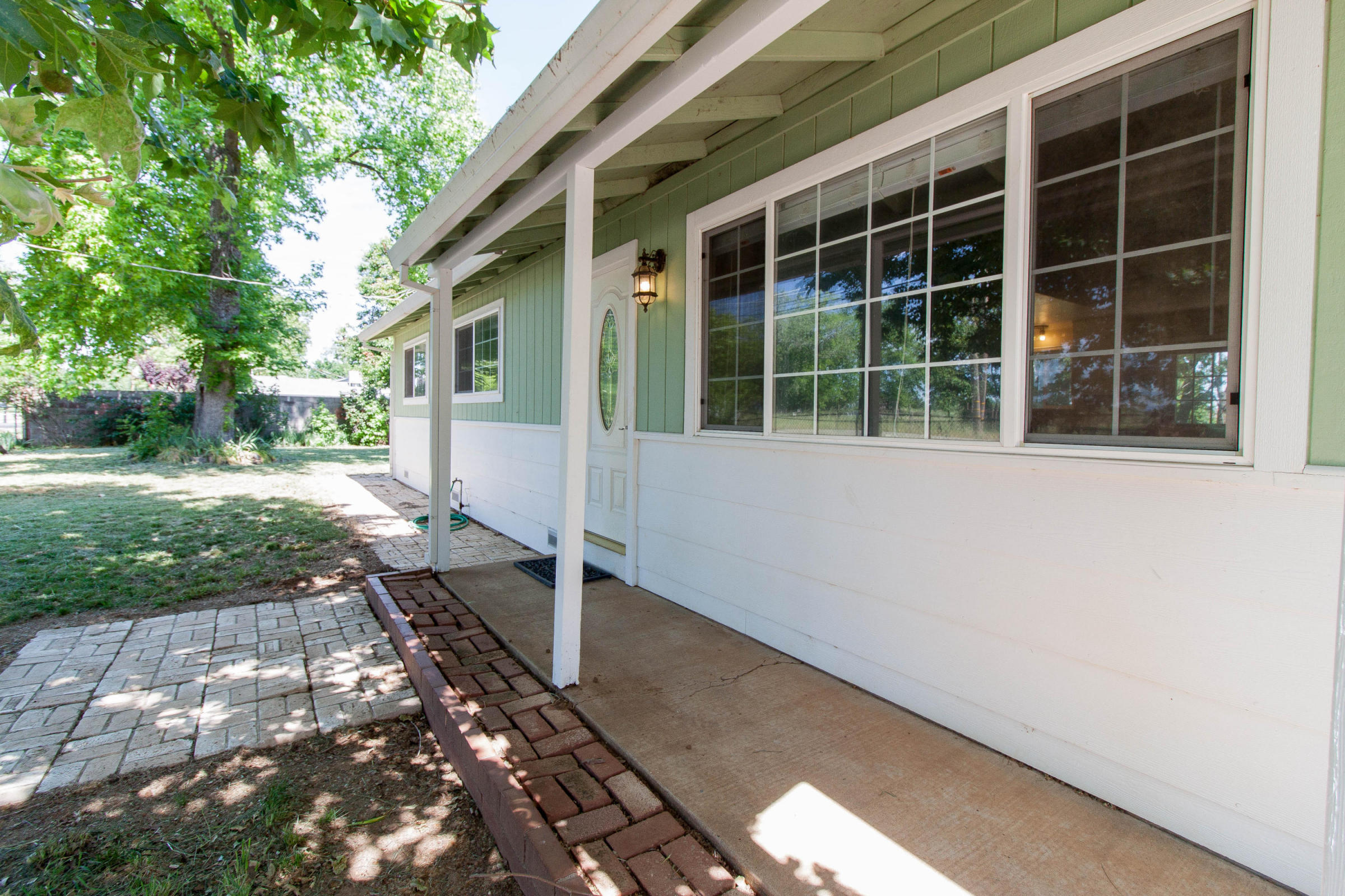 4801 Balls Ferry Road Anderson, CA 96007 - Photo 2 of 22 a front view of a house with a yard