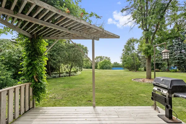 a view of a backyard with wooden floor