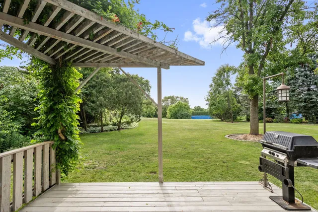 a view of a backyard with wooden floor