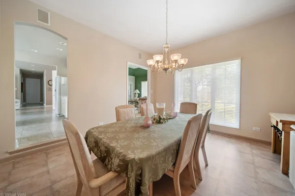 a view of a dining room with furniture window and outside view