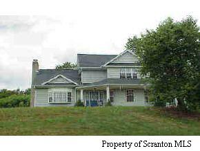 2016 St Nicholson Pa, Unit RRSR Nicholson, PA 18446 - Photo 1 of 3 a front view of a house with a garden