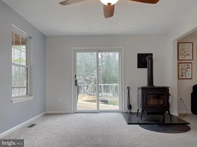 a view of a livingroom with furniture and a window