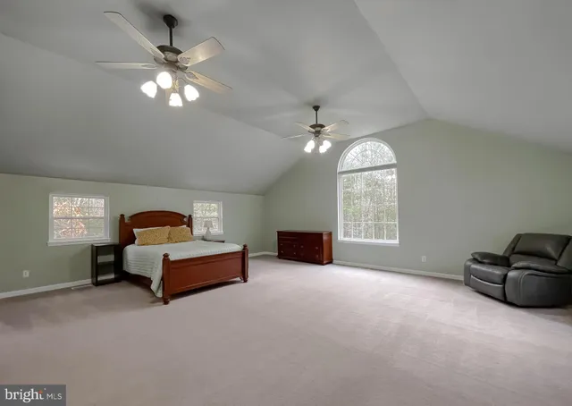 a view of an empty room with a cabinet