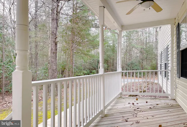 a view of a balcony with wooden floor