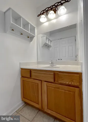 a front view of a house with a garden and swimming pool