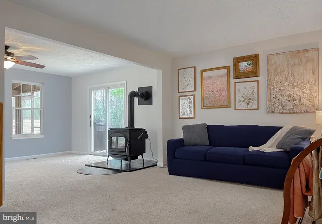 a living room with furniture window and couch