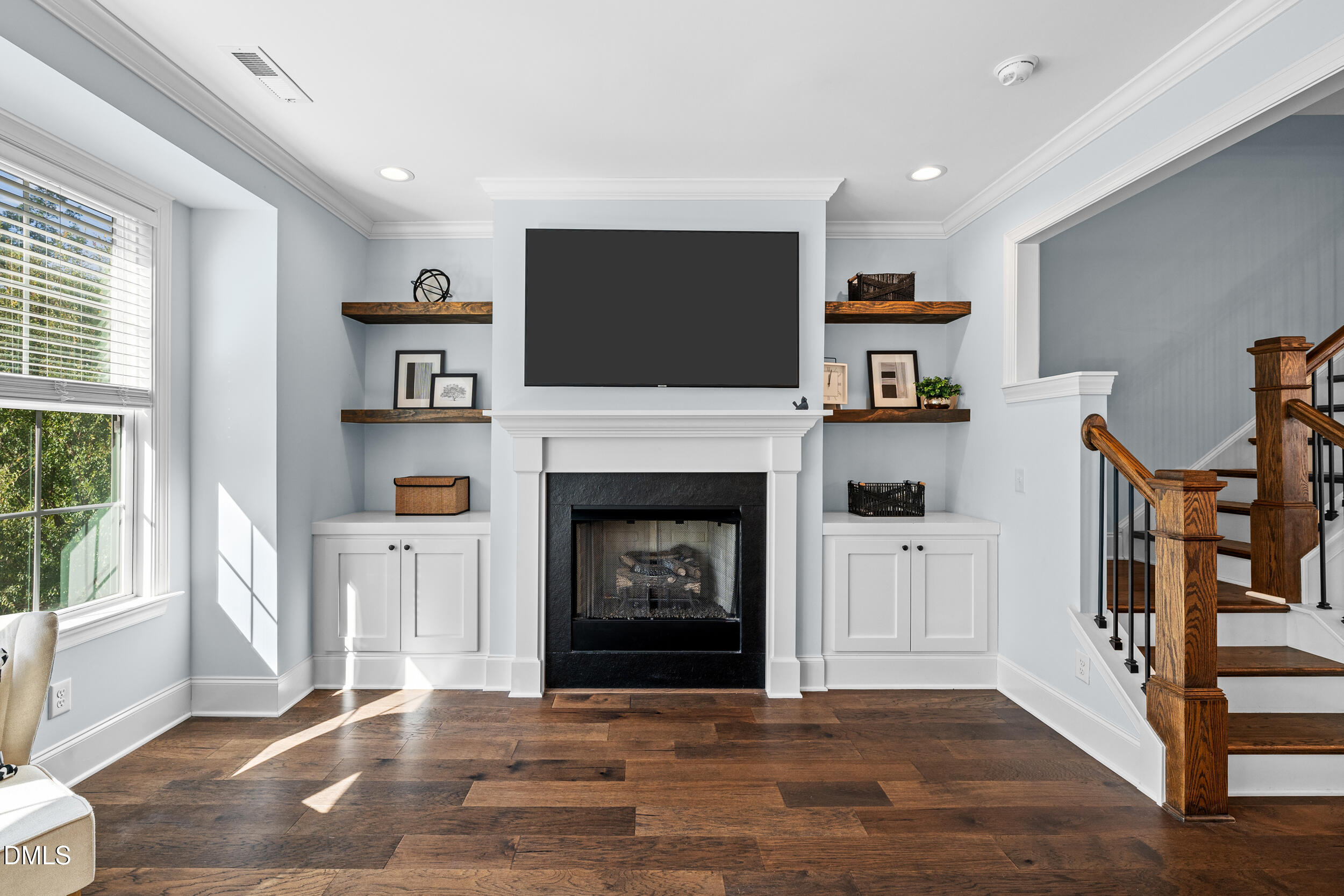1606 Wooster Street Raleigh, NC 27607 - Photo 16 of 26 a living room with furniture and a fireplace