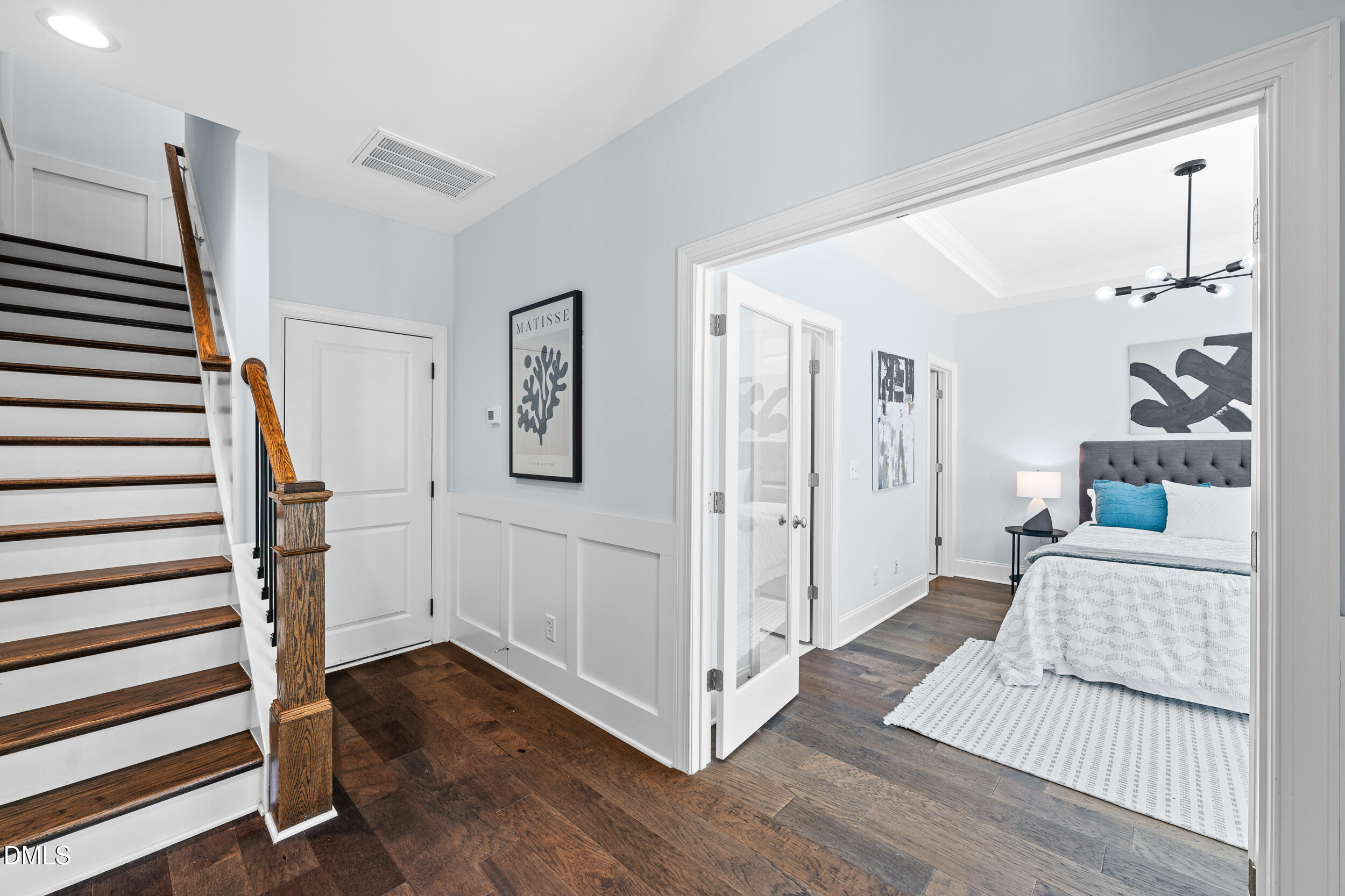1606 Wooster Street Raleigh, NC 27607 - Photo 4 of 26 a view of a livingroom with wooden floor and stairs