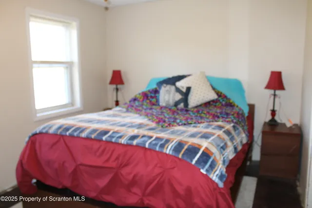 a bath room with a sink a toilet and a mirror