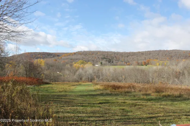 a view of a lake with mountains in the background