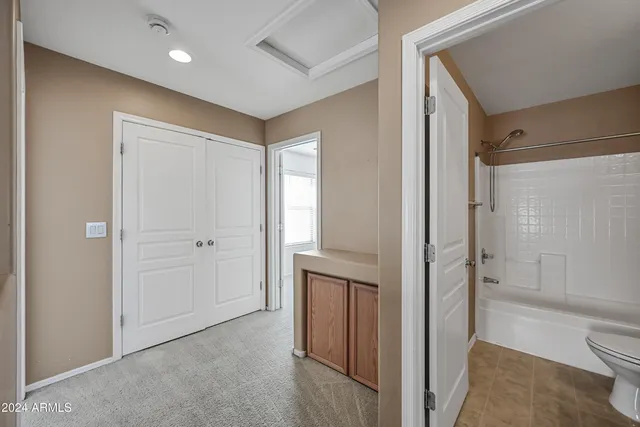 a bathroom with a shower and a toilet