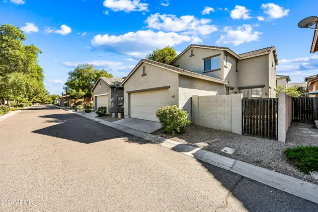 a front view of a house with yard