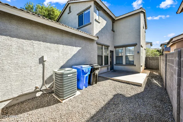 a view of a patio with table and chairs