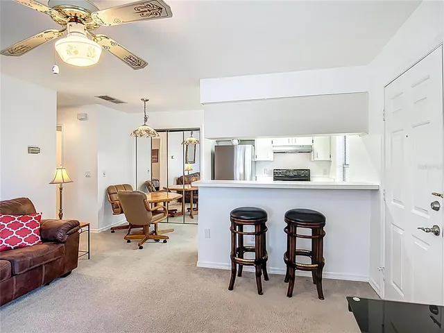 a view of living room with furniture and a window