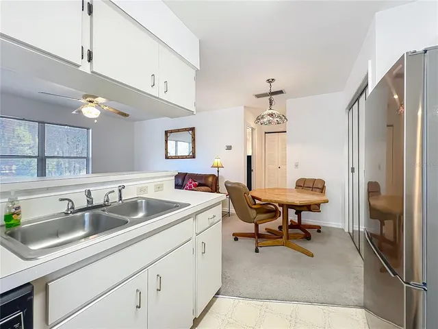 a kitchen with a sink cabinets and appliances