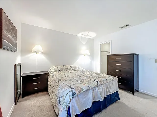 a bedroom with a bed and a closet