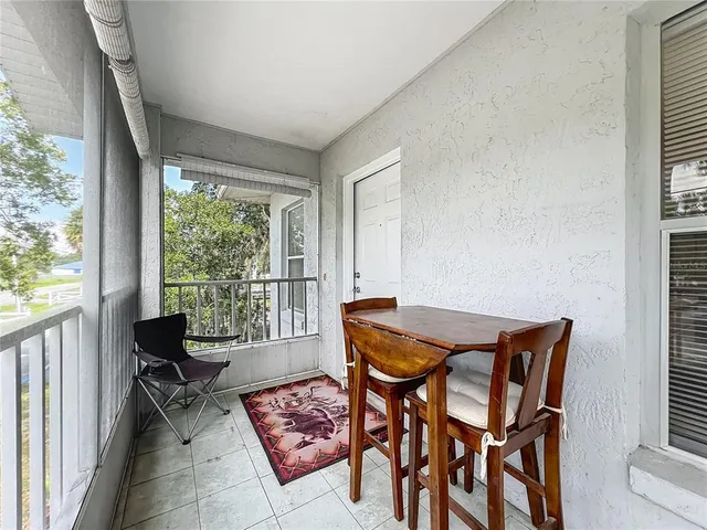 a view of a livingroom with furniture and a table