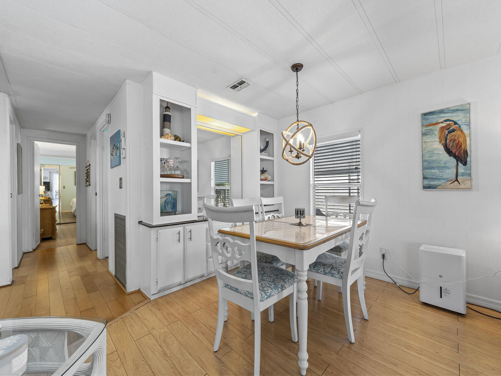 806 South Jade Drive Key Largo, FL 33037 - Photo 6 of 37 a view of a dining room with furniture wooden floor and a chandelier