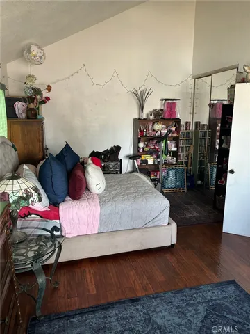 a bedroom with bed and a walk in closet