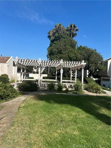 a front view of a house with a yard table and chairs