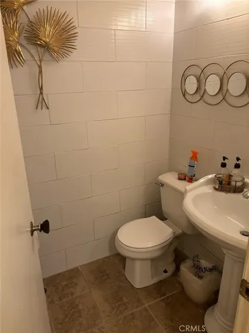 a bathroom with a toilet and a sink