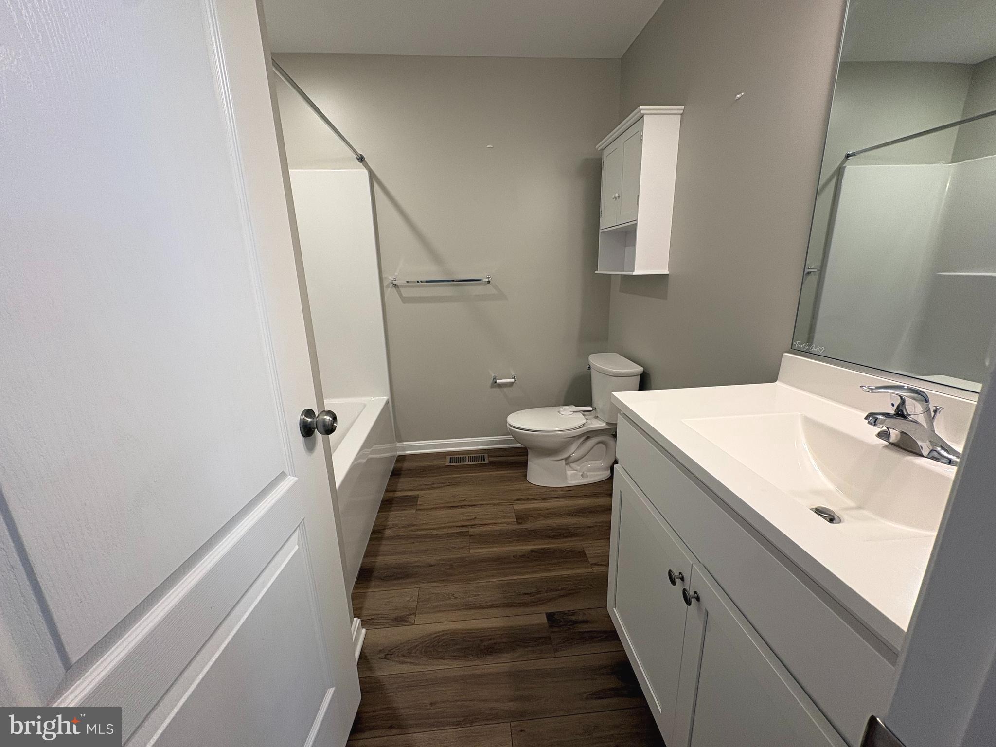 148 East Step Road Chestertown, MD 21620 - Photo 19 of 46 a bathroom with a sink and mirror with toilet