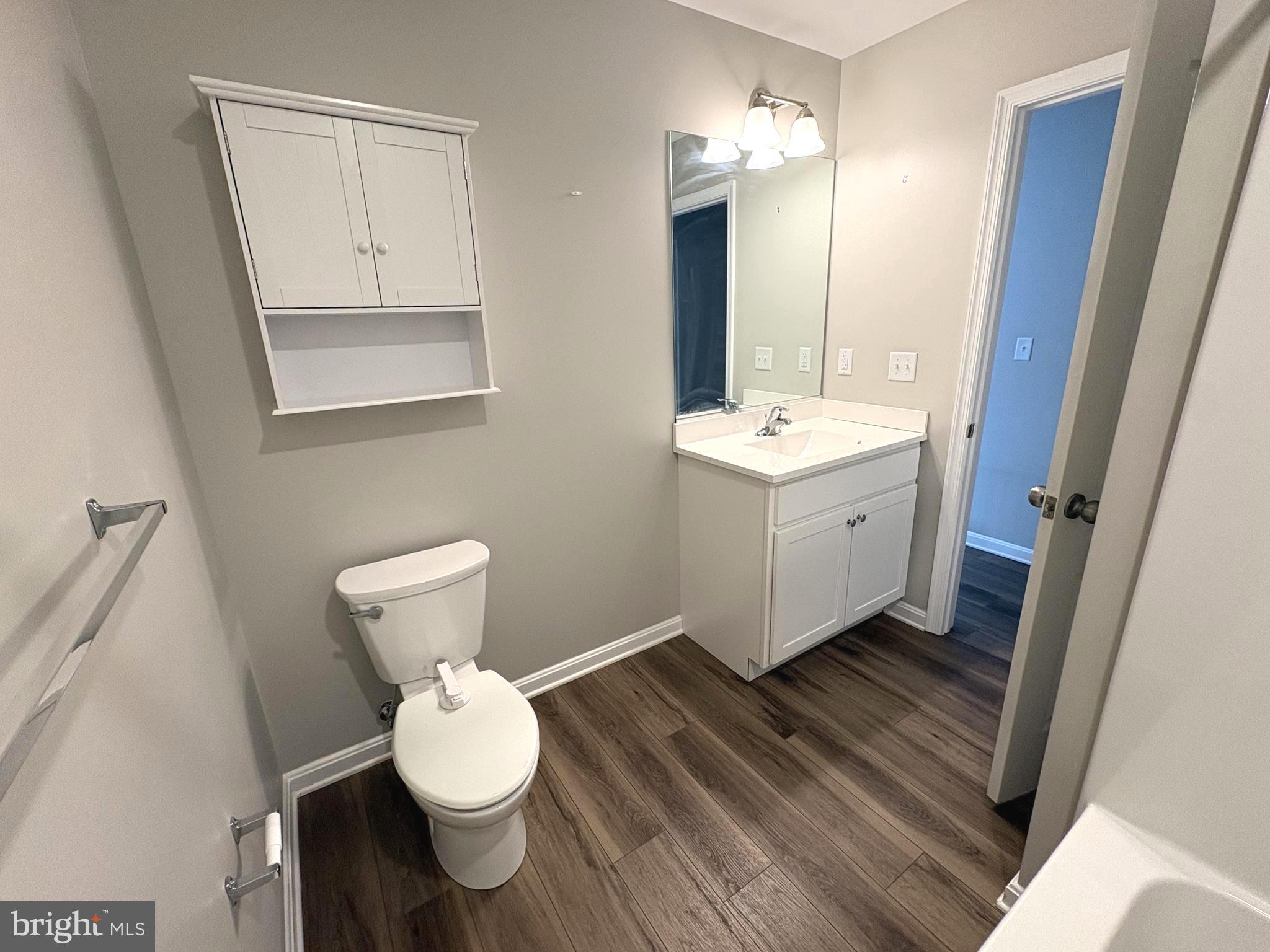 148 East Step Road Chestertown, MD 21620 - Photo 23 of 46 a bathroom with a sink mirror vanity and toilet