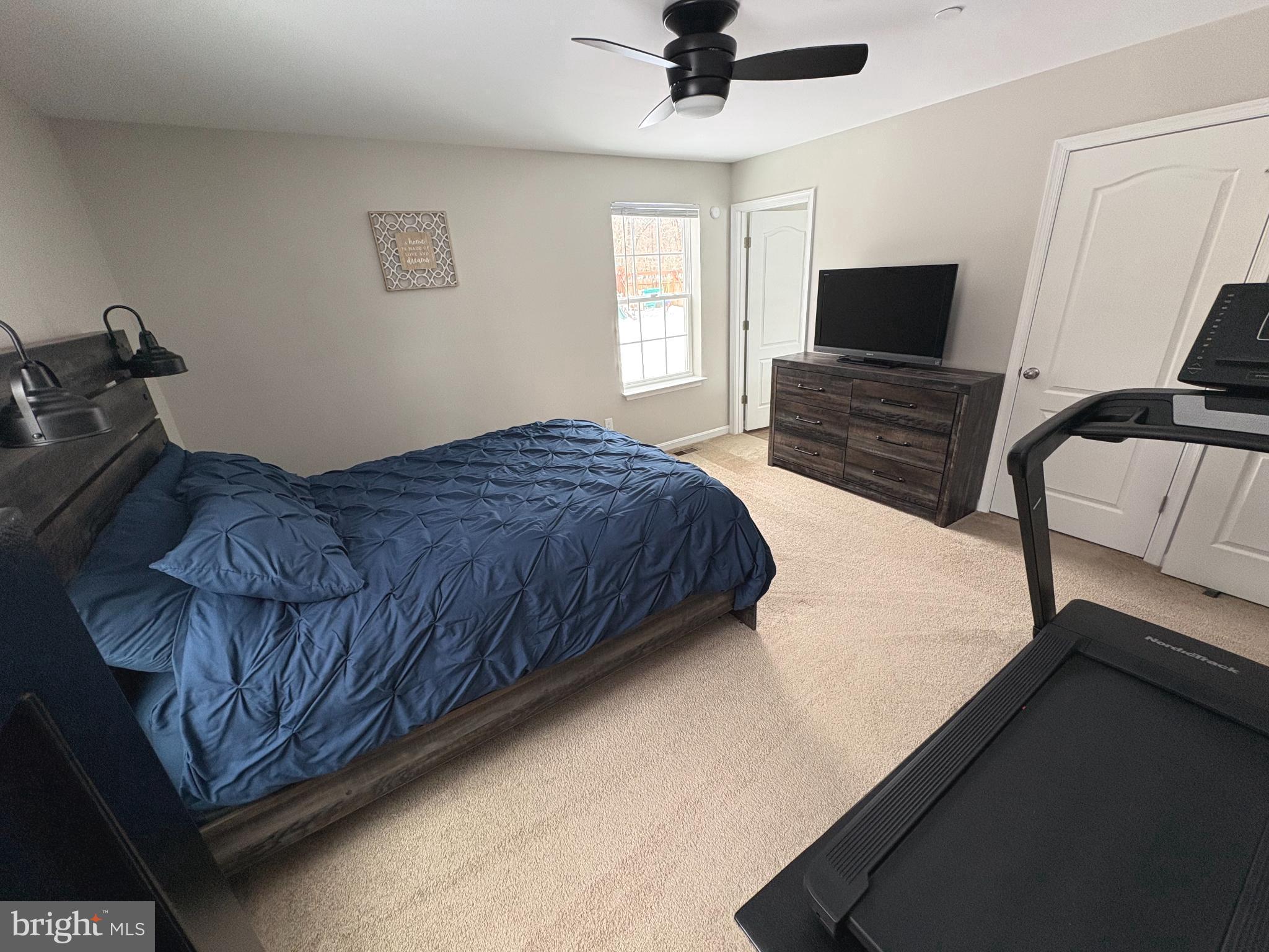 148 East Step Road Chestertown, MD 21620 - Photo 29 of 46 a bedroom with a bed wooden floor and ceiling fan