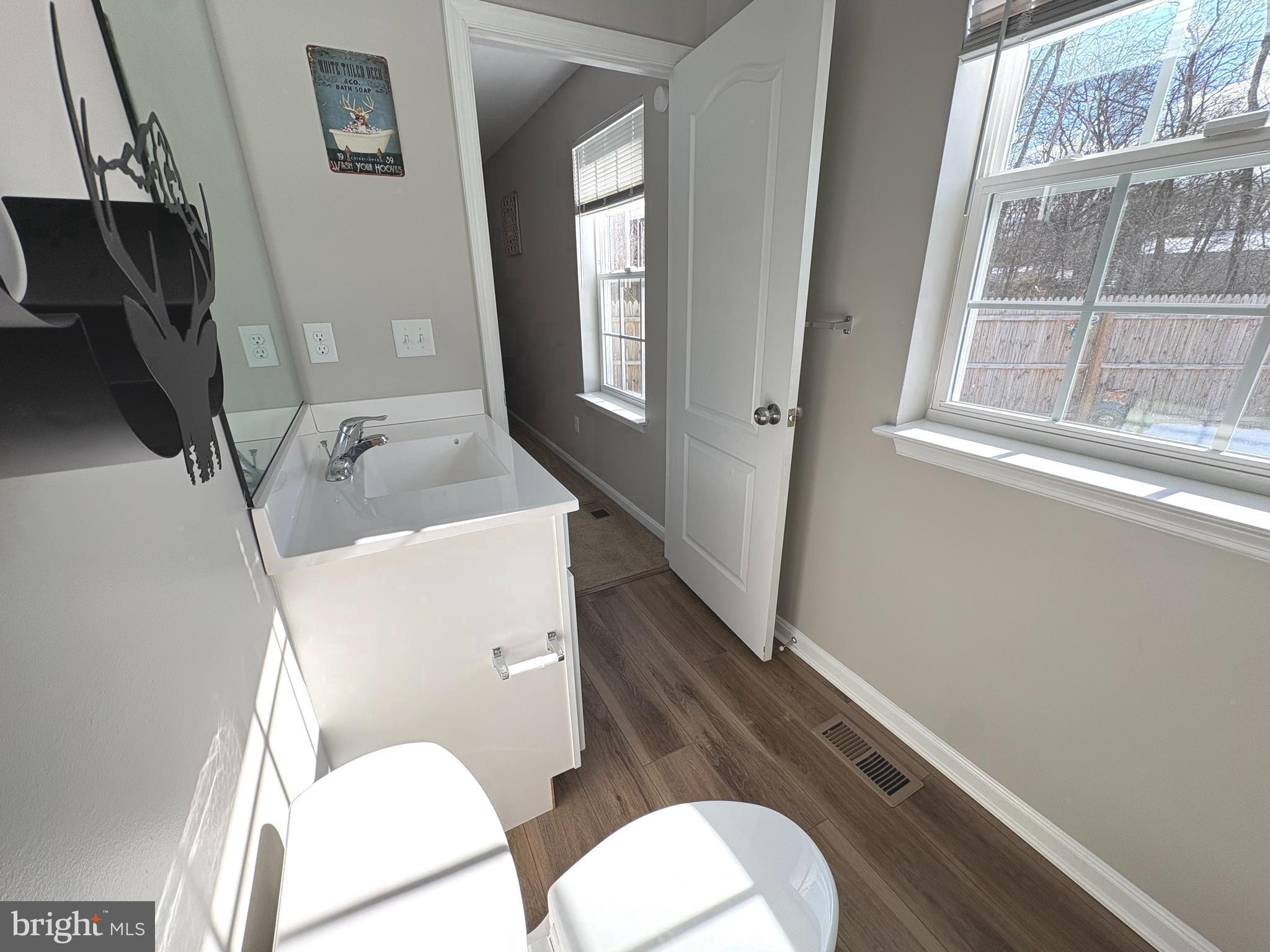 148 East Step Road Chestertown, MD 21620 - Photo 32 of 46 a white toilet sitting next to a bathroom sink