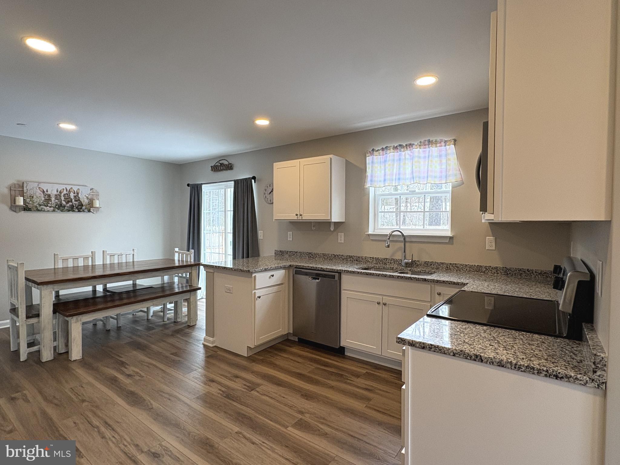 148 East Step Road Chestertown, MD 21620 - Photo 4 of 46 a kitchen with granite countertop cabinets stainless steel appliances a sink and a window