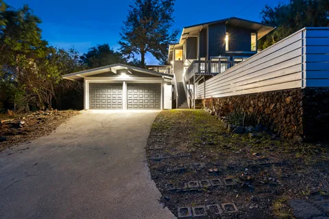 a front view of a house with yard