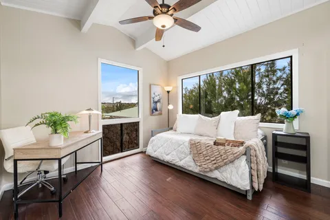 a bedroom with a bed and a table