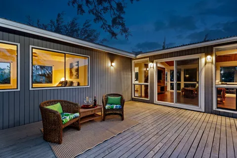 a outdoor living space with furniture and wooden floor