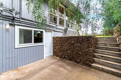 a view of a house with a tree