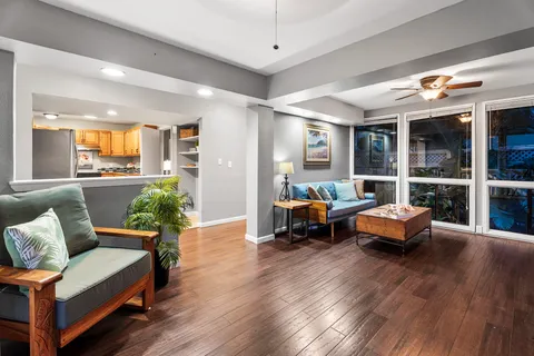 a living room with furniture and a large window