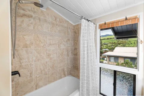 a bathroom with a shower and a sink