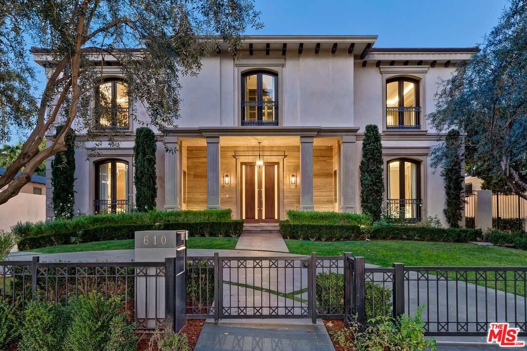 610 North Rodeo Drive Beverly Hills, CA 90210 - Photo 1 of 38 front view of house with a yard