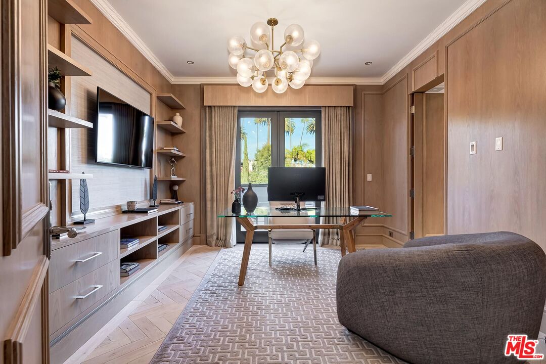 610 North Rodeo Drive Beverly Hills, CA 90210 - Photo 20 of 38 a living room with furniture a large window and a flat screen tv