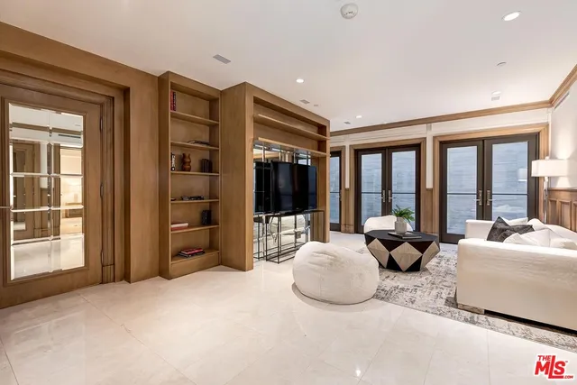 a bed room with furniture and a large window