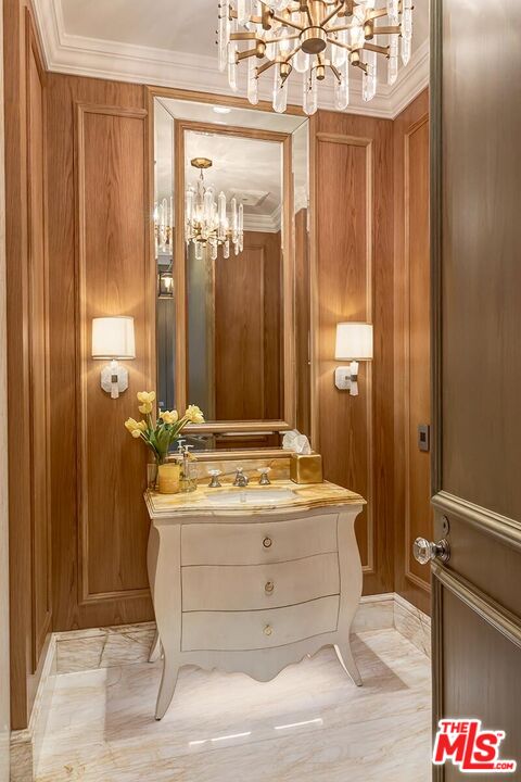 610 North Rodeo Drive Beverly Hills, CA 90210 - Photo 5 of 38 a spacious bathroom with a sink and a mirror