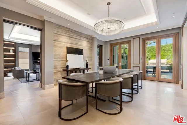 a view of a dining room with furniture wooden floor and chandelier