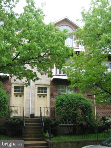 3062 South Glebe Road, Unit 3062 Arlington, VA 22206 - Photo 1 of 9 a front view of a house with a yard