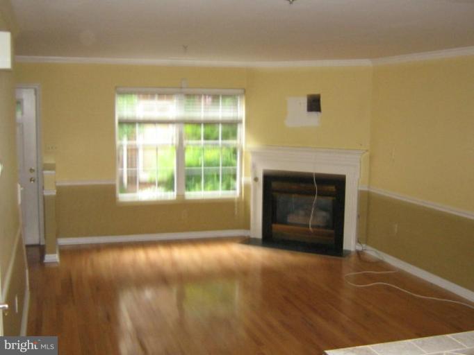 3062 South Glebe Road, Unit 3062 Arlington, VA 22206 - Photo 5 of 9 a view of empty room with a fireplace