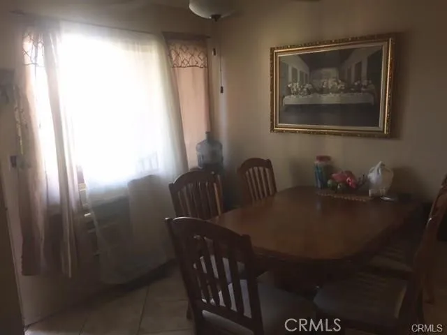 a kitchen with stainless steel appliances granite countertop a refrigerator a stove and a sink