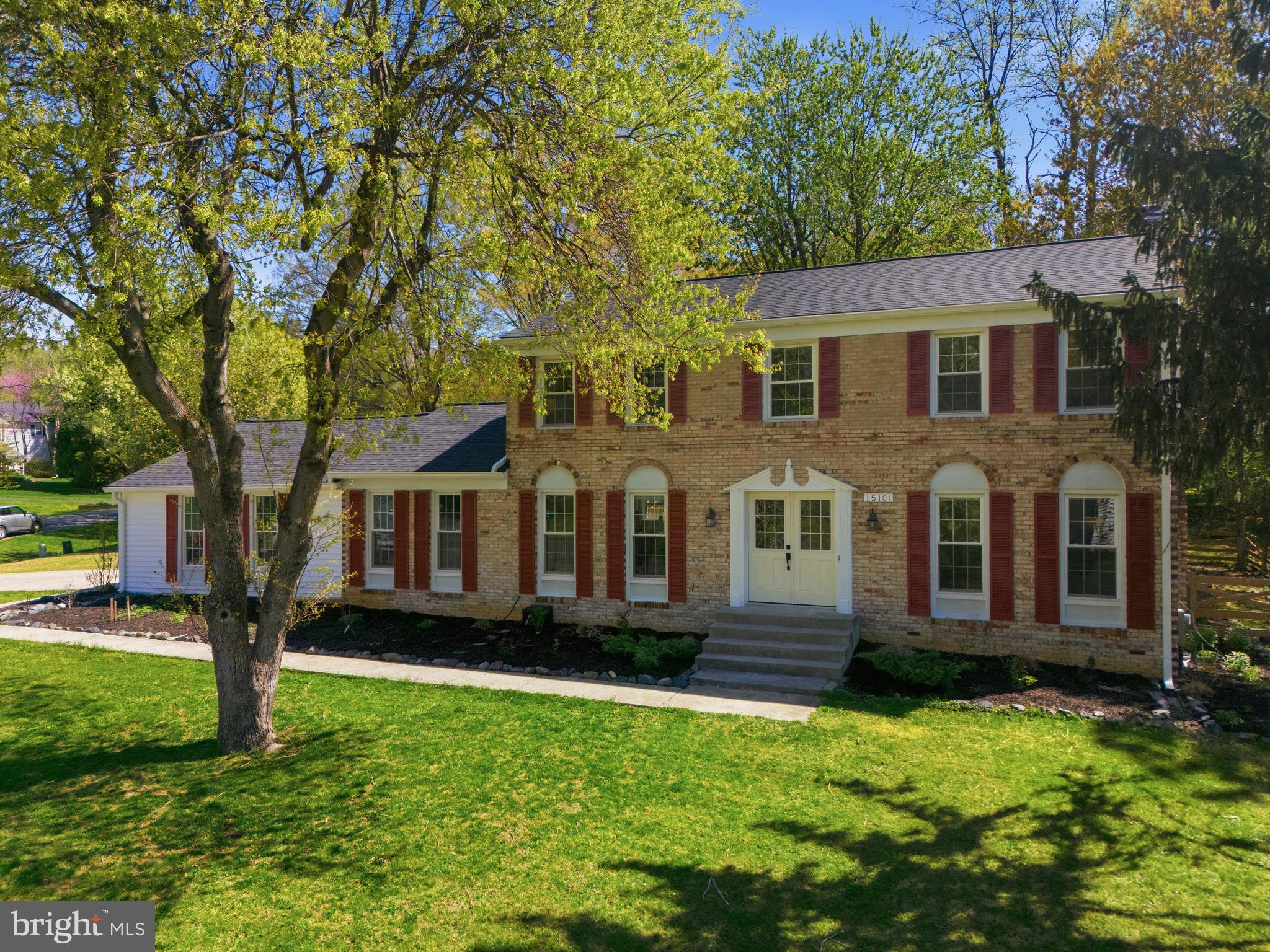15101 Redgate Drive Silver Spring, MD 20905 - Photo 1 of 39 a front view of a house with a yard