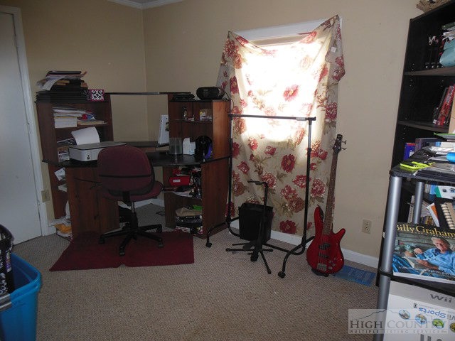 146 Nile Road Sparta, NC 28675 - Photo 4 of 19 a view of a workspace with furniture and a window