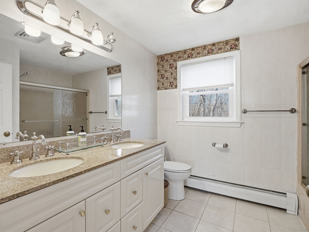 90 Blue Ridge Road North Andover, MA 01845 - Photo 15 of 26 a bathroom with a granite countertop sink mirror and a toilet