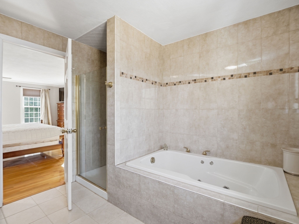90 Blue Ridge Road North Andover, MA 01845 - Photo 16 of 26 a bathroom with a bathtub and a shower