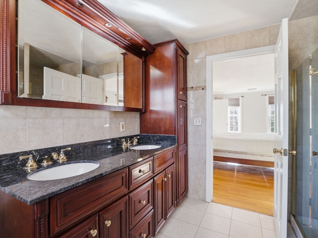 90 Blue Ridge Road North Andover, MA 01845 - Photo 19 of 26 a kitchen with a sink and a stove