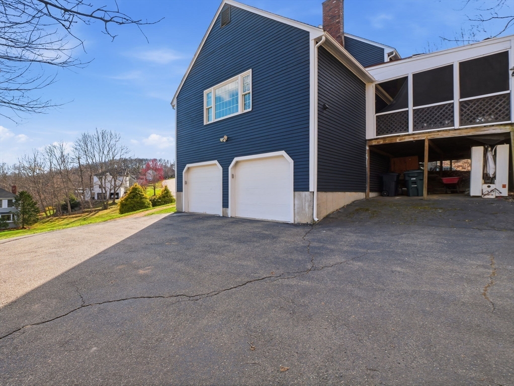 90 Blue Ridge Road North Andover, MA 01845 - Photo 24 of 26 a view of a house with a yard and garage